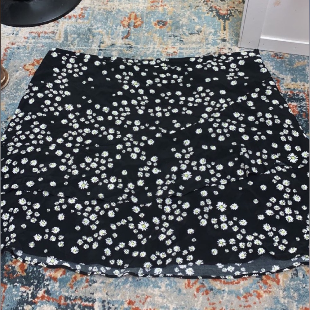 Black skirt with white and yellow flowers